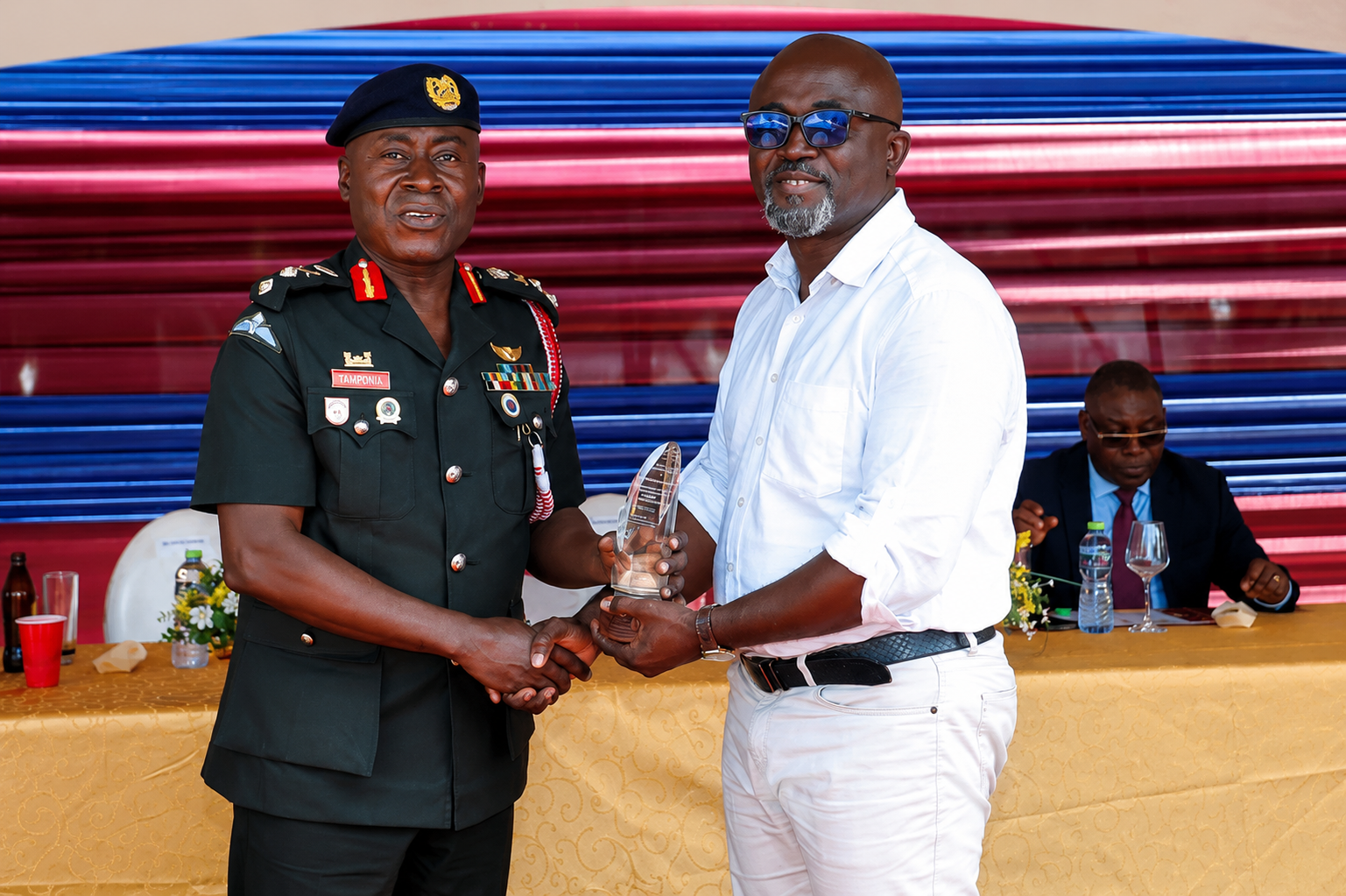 Eric Donkor receives an award on behalf of White Beam Concepts for contribution to the construction of the Hold Fast Conference Hall
